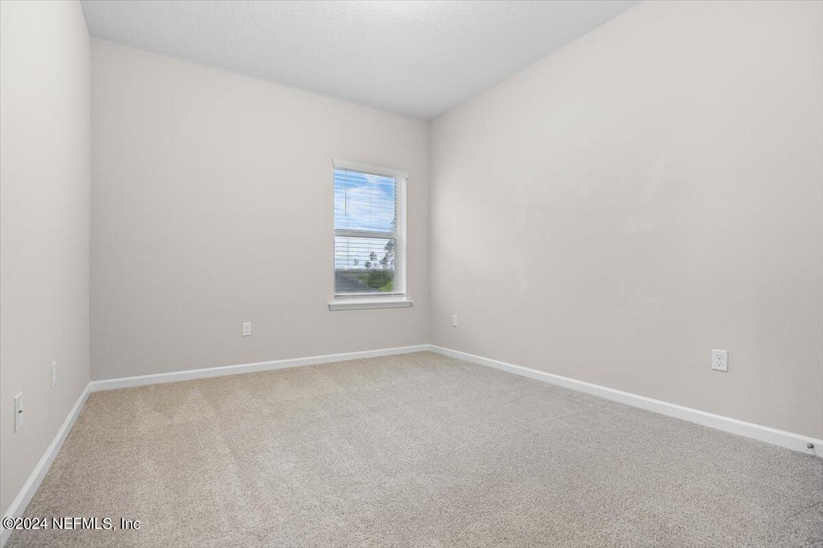 70 Stargaze Lane St. Augustine, FL 32095 - Photo 17 of 41 an empty room with windows