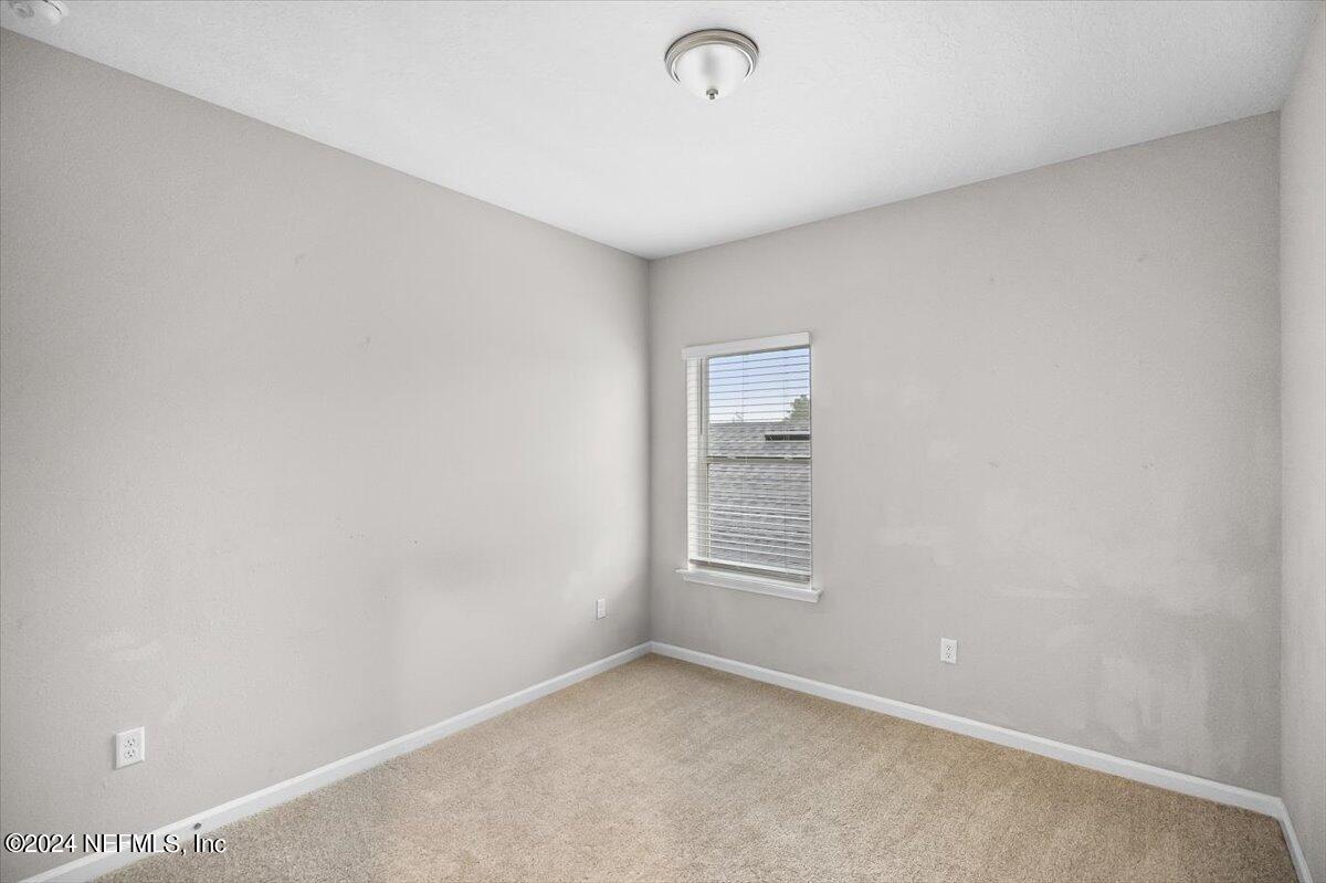 70 Stargaze Lane St. Augustine, FL 32095 - Photo 19 of 41 an empty room with windows