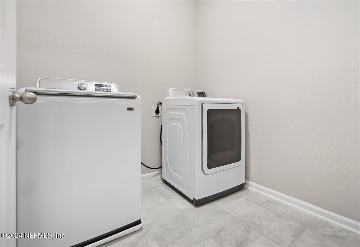 70 Stargaze Lane St. Augustine, FL 32095 - Photo 22 of 41 a utility room with dryer and washer