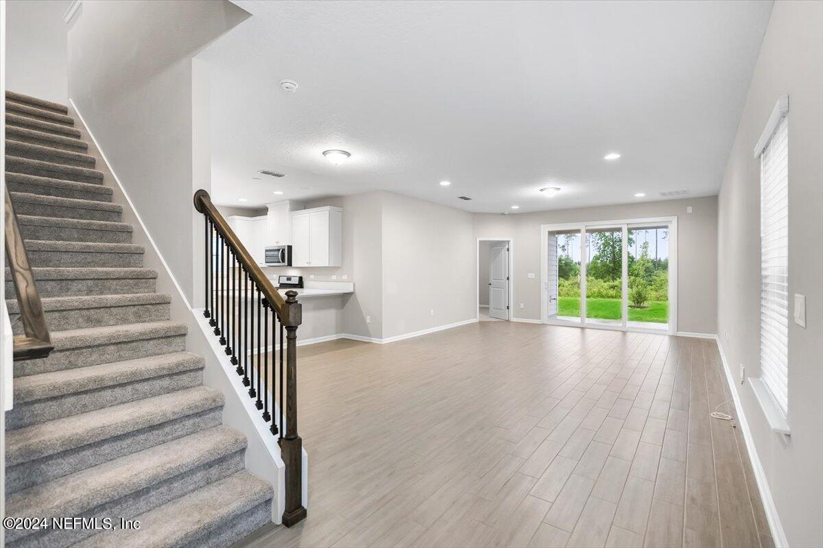 70 Stargaze Lane St. Augustine, FL 32095 - Photo 4 of 41 a view of entryway and hall with wooden floor