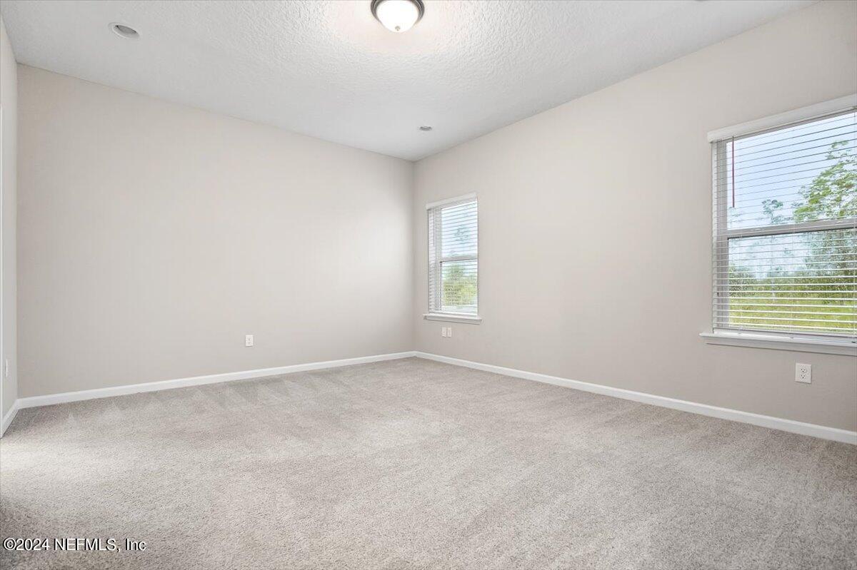 70 Stargaze Lane St. Augustine, FL 32095 - Photo 10 of 41 an empty room with windows