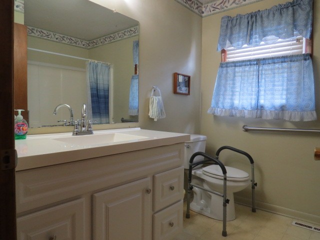 1549 Mill Street Pulaski, TN 38478 - Photo 12 of 24 a bathroom with a sink a light fixture and a mirror