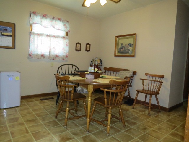 1549 Mill Street Pulaski, TN 38478 - Photo 10 of 24 a view of a dining room with furniture and chandelier