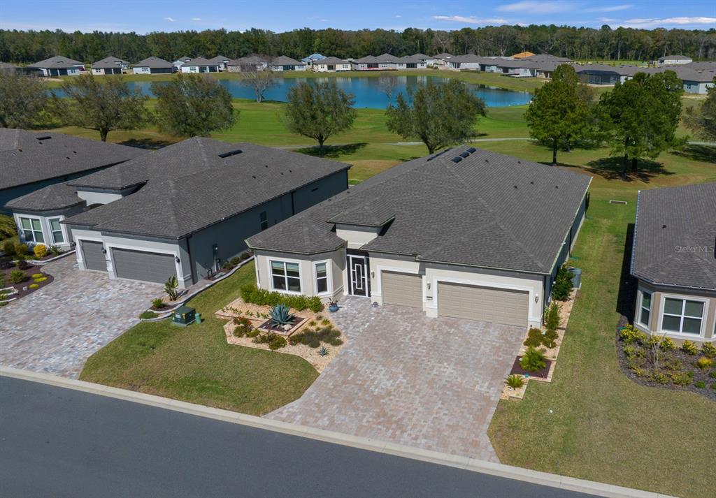 8825 Southwest 57th Pl Road Ocala, FL 34481 - Photo 1 of 1 an aerial view of a house with lake view