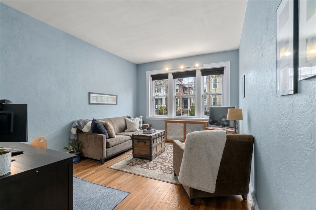 90 Kilsyth Road, Unit 2 Boston, MA 02135 - Photo 4 of 18 a living room with furniture and a flat screen tv