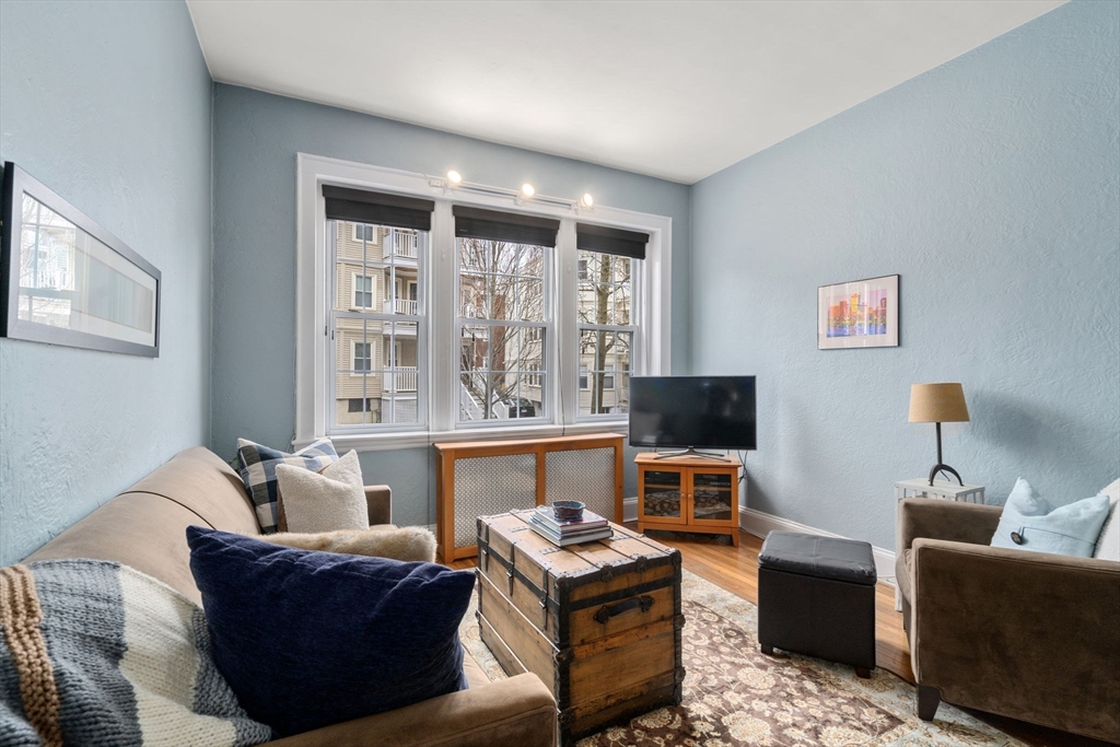 90 Kilsyth Road, Unit 2 Boston, MA 02135 - Photo 5 of 18 a living room with furniture and a flat screen tv