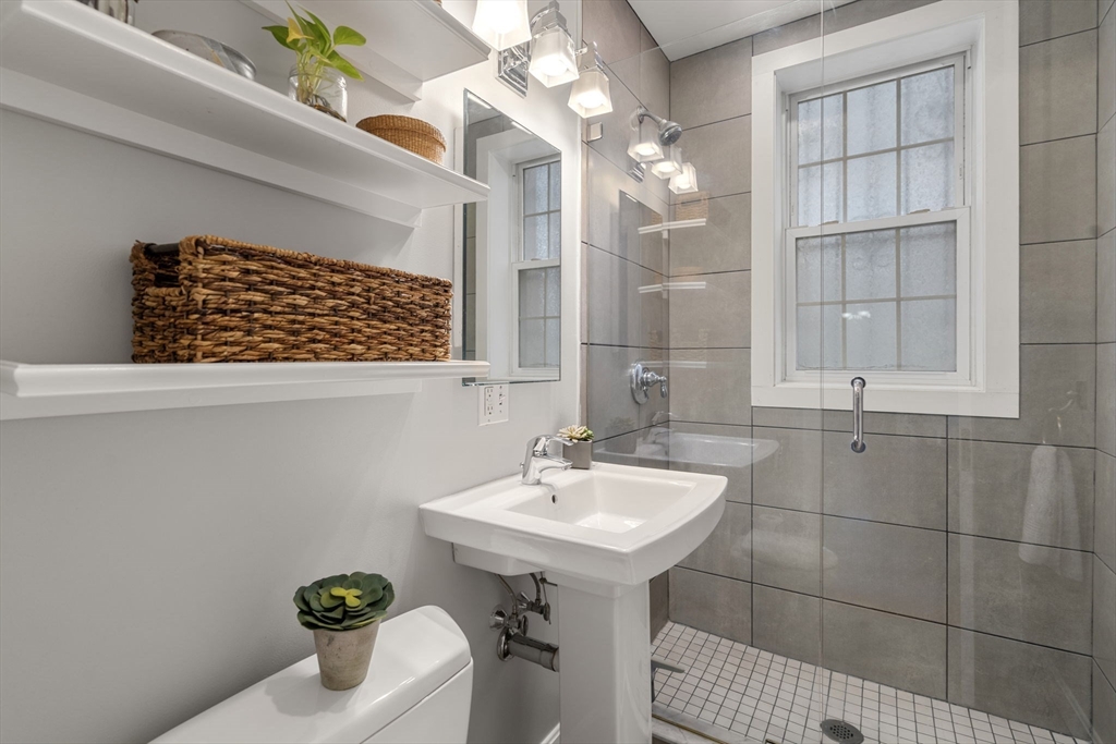 90 Kilsyth Road, Unit 2 Boston, MA 02135 - Photo 8 of 18 a bathroom with a sink and a mirror
