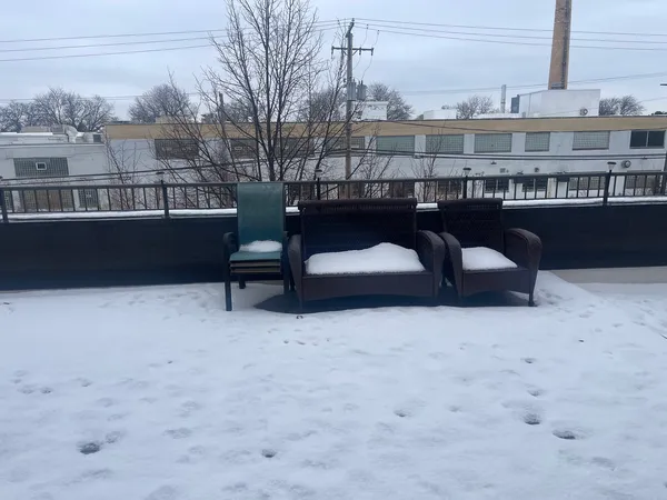 a view of roof deck with patio