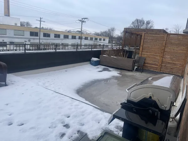a view of a garage with parked cars
