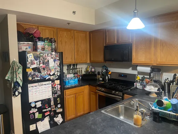 a living room with table chairs and a dining table