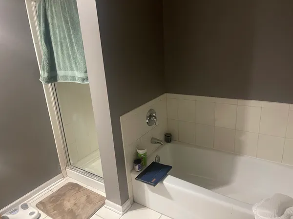 a bed room with a bed and a lamp