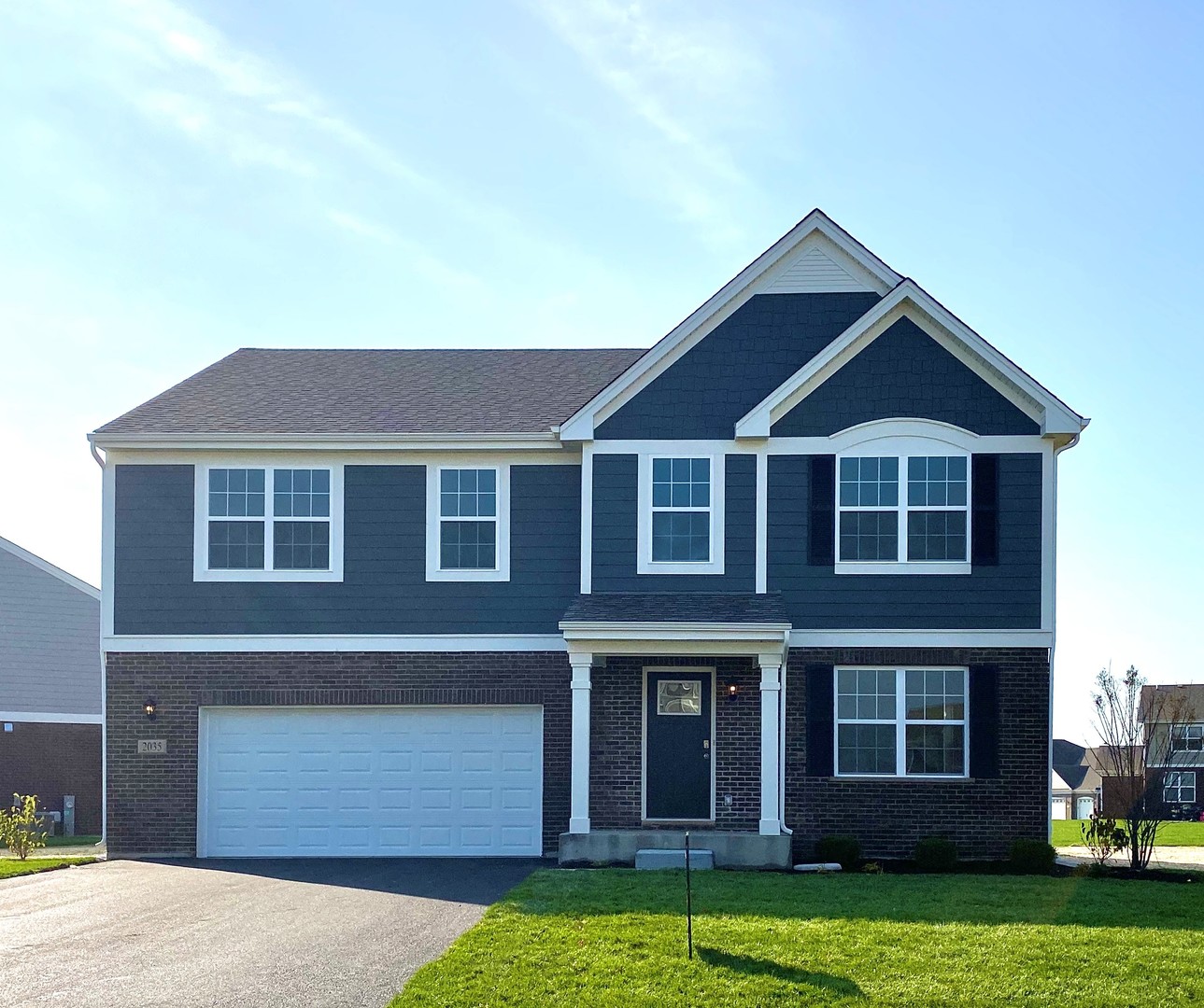 2035 Rownham Hill Road New Lenox, IL 60451 - Photo 1 of 15 a front view of a house with garden