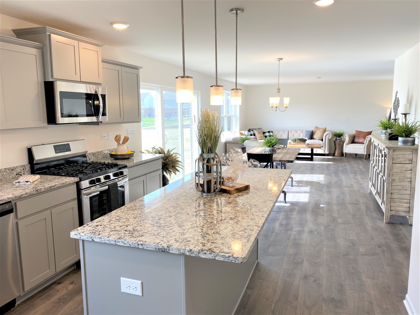 2035 Rownham Hill Road New Lenox, IL 60451 - Photo 7 of 15 a kitchen with sink a counter and chairs