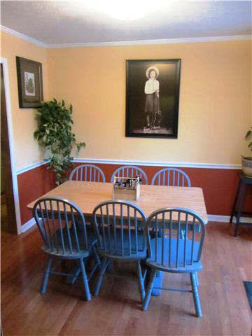 2401 Cairo Bend Road Lebanon, TN 37087 - Photo 9 of 18 a view of a dining room with furniture and wooden floor