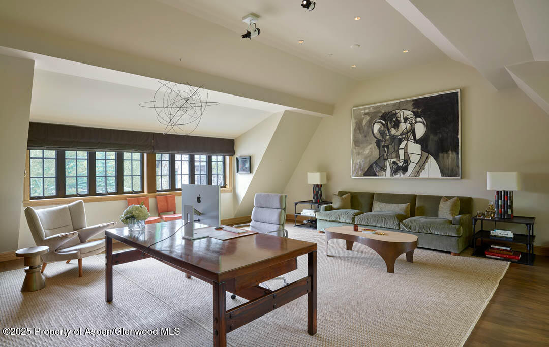 864 Moore Drive Aspen, CO 81611 - Photo 20 of 37 a living room with furniture a rug and a large window