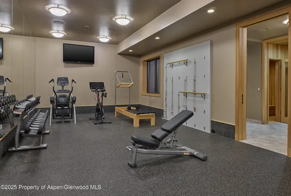 a living room with furniture pool and a flat screen tv