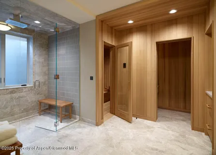 a view of a hallway with bathroom