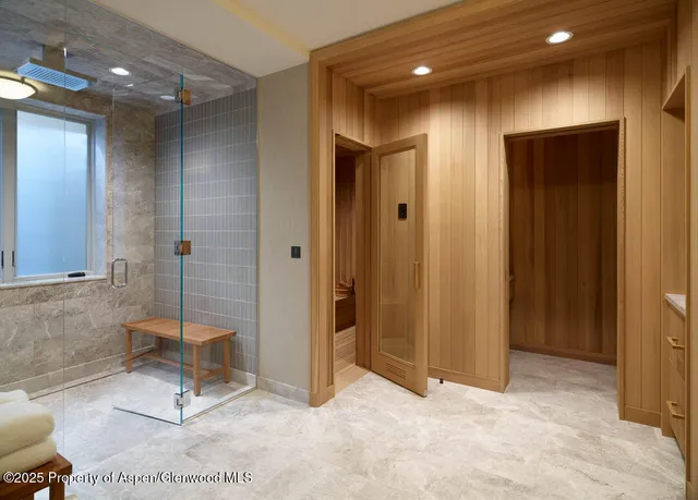 a view of a hallway with bathroom