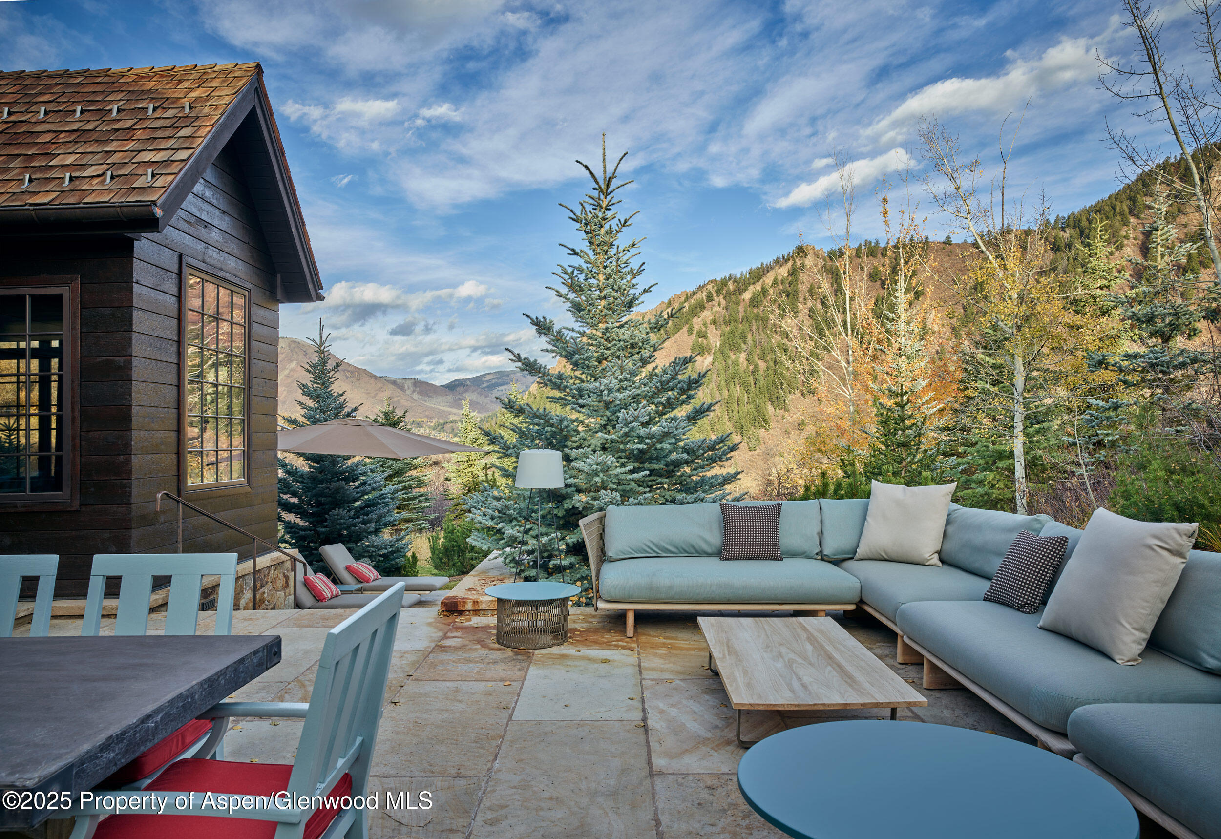 864 Moore Drive Aspen, CO 81611 - Photo 25 of 37 a backyard of a house with outdoor seating