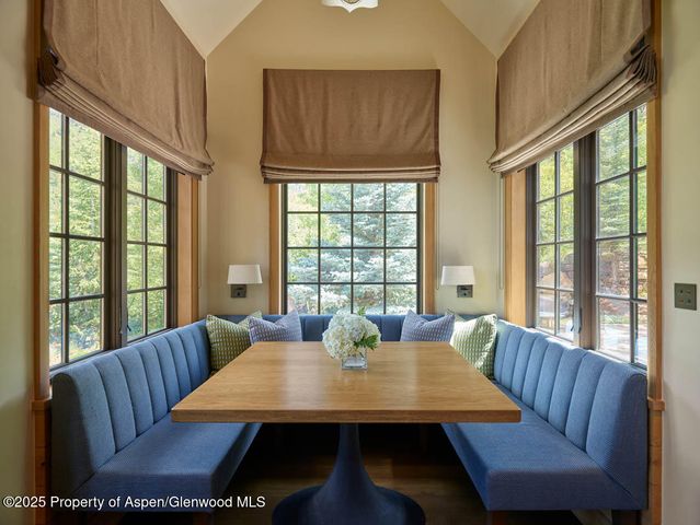 a view of a dining room with furniture window and outside view