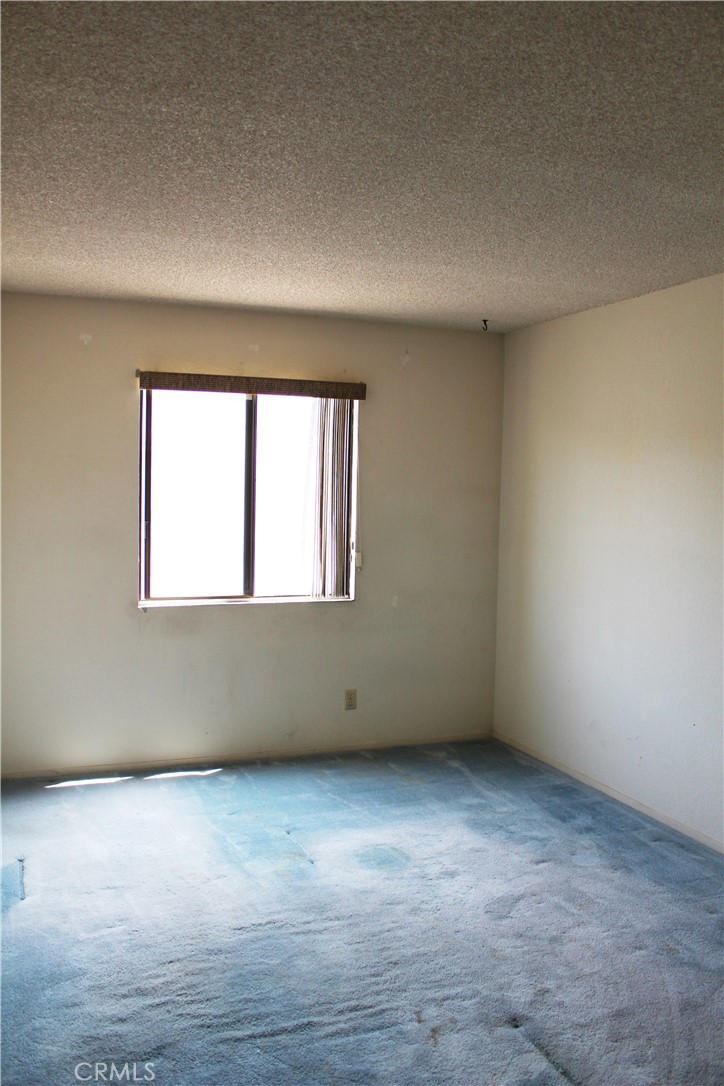 828 East Boone Street, Unit 12 Santa Maria, CA 93454 - Photo 17 of 32 an empty room with a window