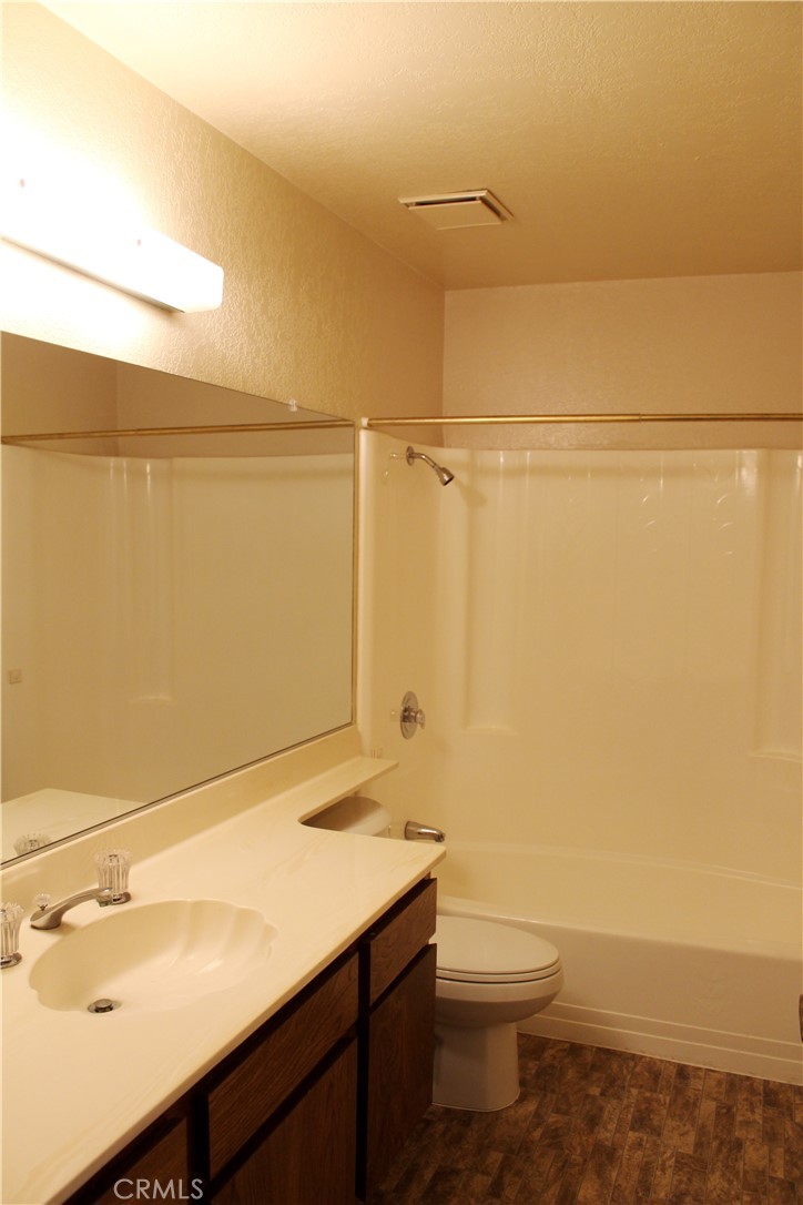 828 East Boone Street, Unit 12 Santa Maria, CA 93454 - Photo 19 of 32 a bathroom with a sink a toilet and shower