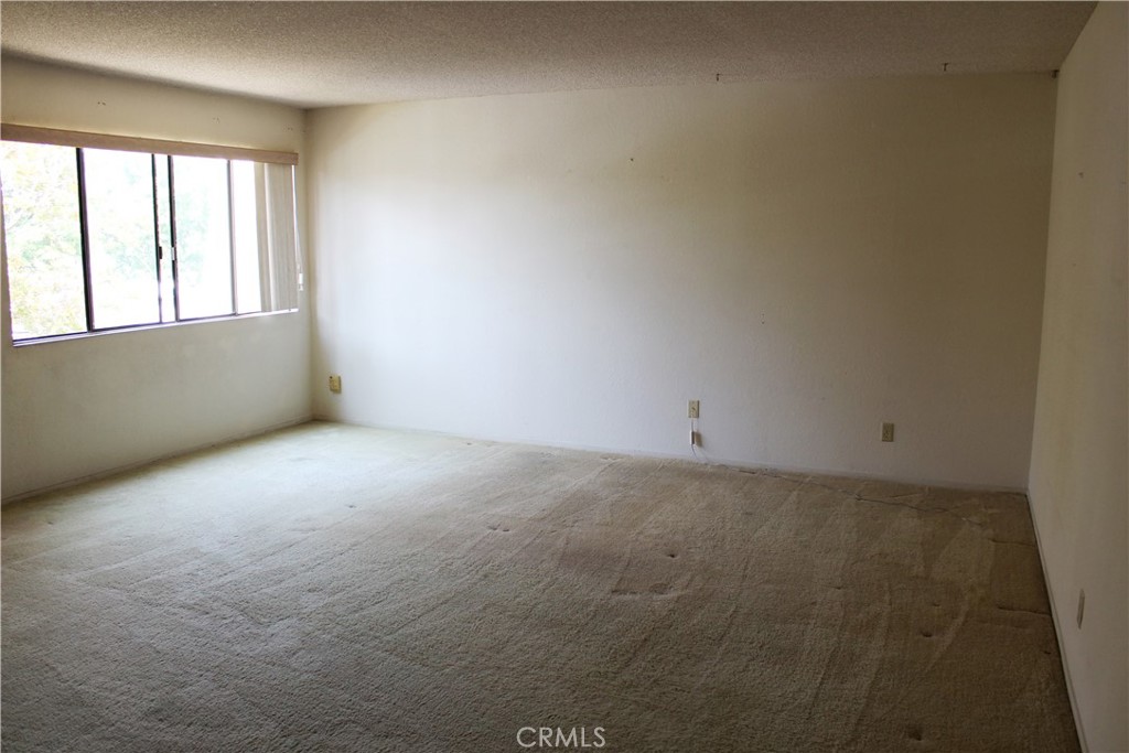 828 East Boone Street, Unit 12 Santa Maria, CA 93454 - Photo 27 of 32 a view of an empty room with a window