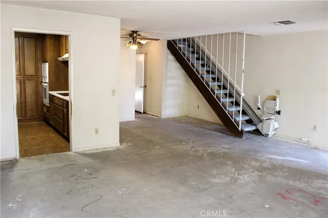 a view of an empty room with stairs