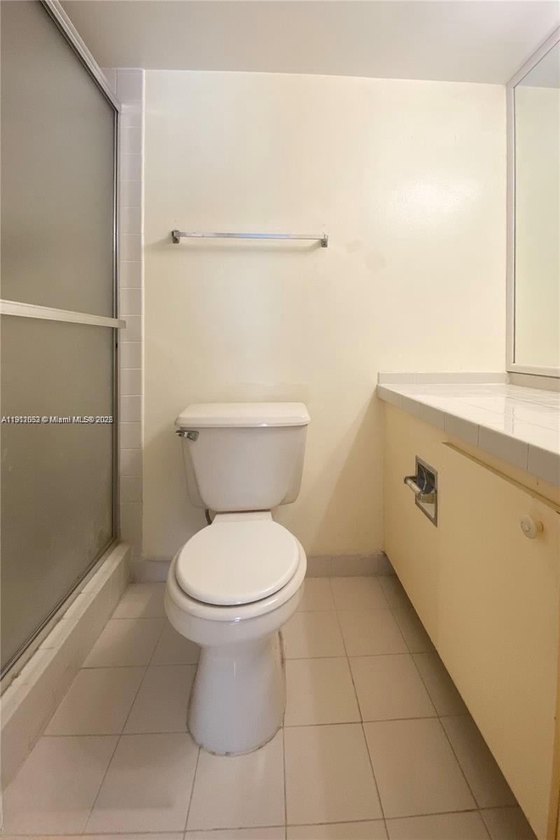 430 Golden Isles Drive, Unit 701 Hallandale Beach, FL 33009 - Photo 4 of 11 a bathroom with a toilet and a sink
