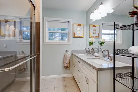 a bathroom with a sink and a mirror