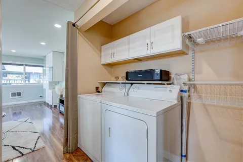 a view of a storage & utility room with washer and dryer