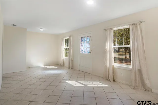 an empty room with windows