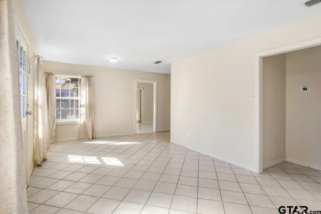 a view of an empty room with window