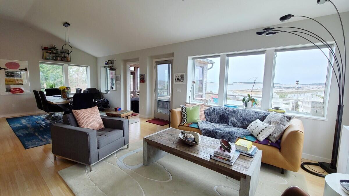 75 Richman Lane Wellfleet, MA 02667 - Photo 15 of 72 a living room with furniture and large windows