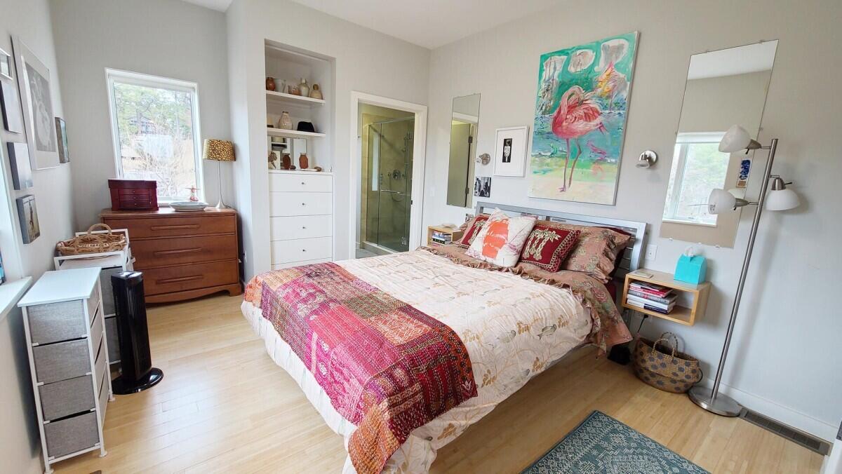 75 Richman Lane Wellfleet, MA 02667 - Photo 22 of 72 a bedroom with a bed and wooden floor