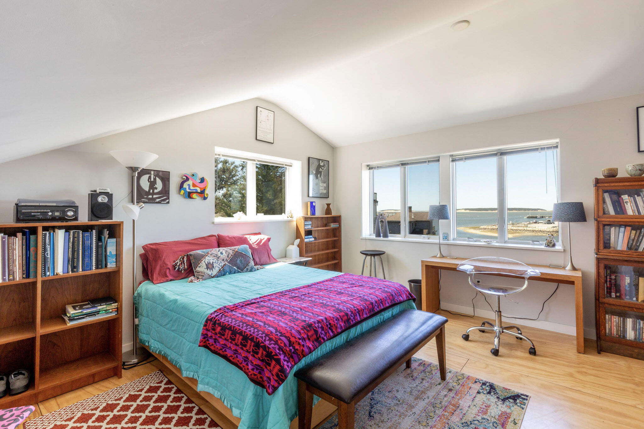 75 Richman Lane Wellfleet, MA 02667 - Photo 30 of 72 a living room with furniture and a book shelf