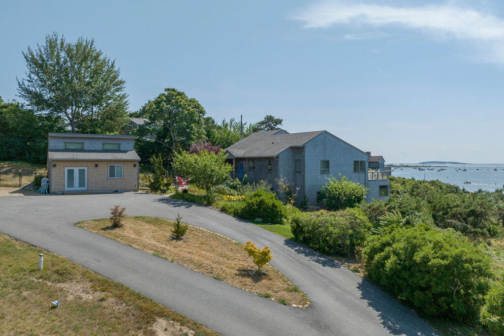 75 Richman Lane Wellfleet, MA 02667 - Photo 4 of 72 a front view of a house with a yard
