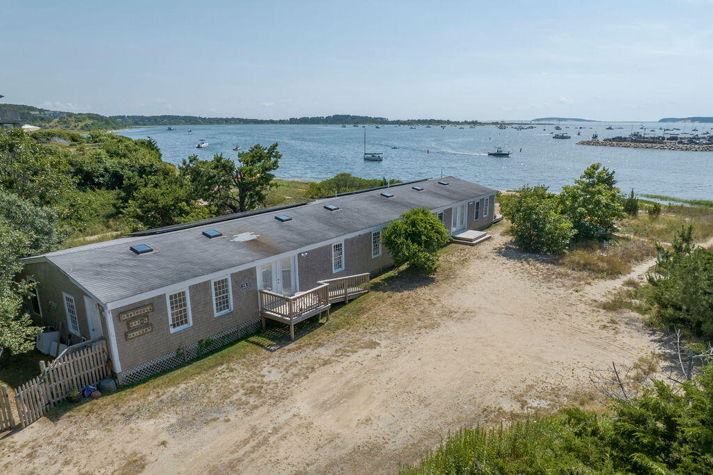75 Richman Lane Wellfleet, MA 02667 - Photo 46 of 72 an aerial view of a house with a garden and mountain view in back
