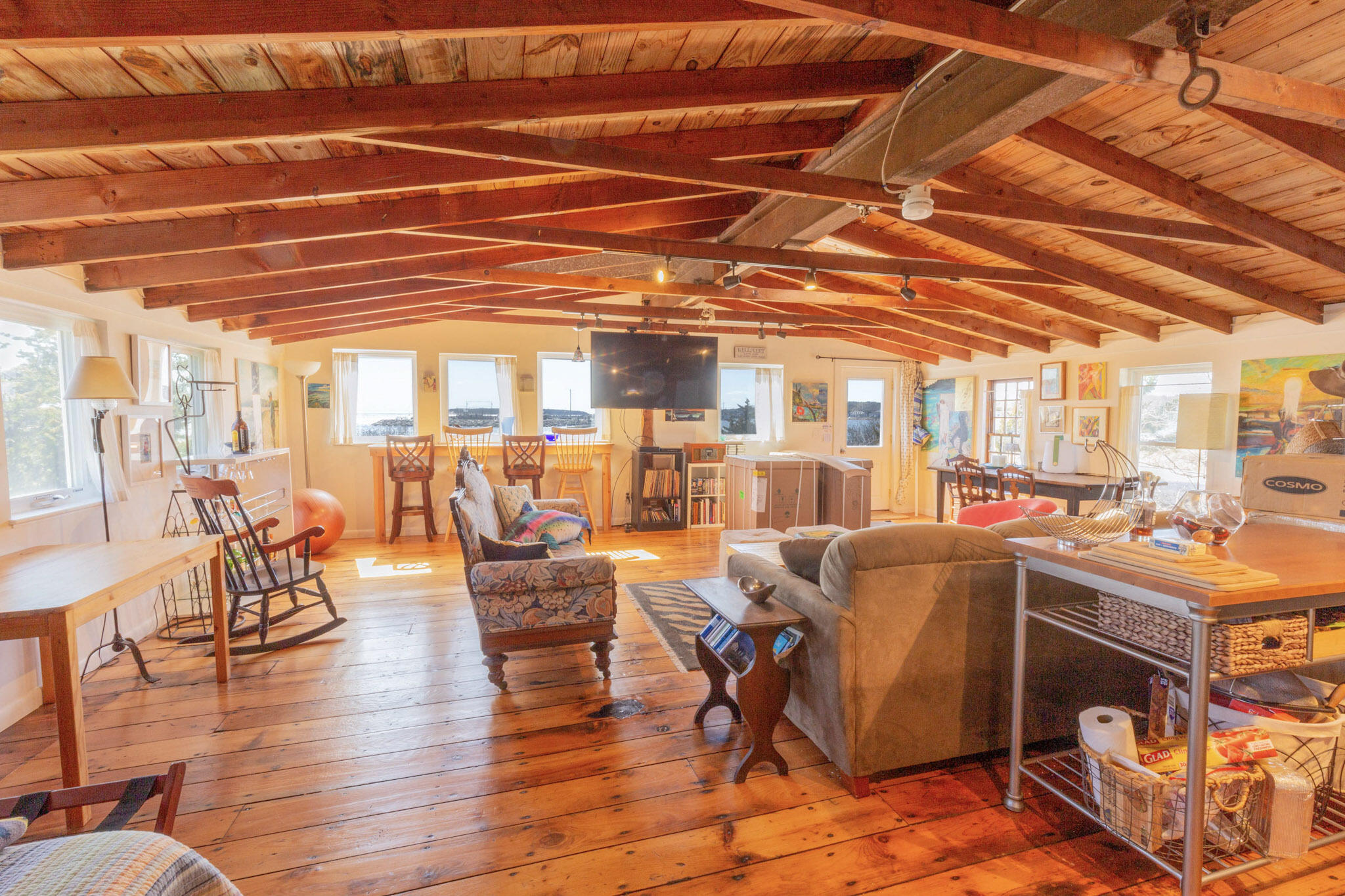 75 Richman Lane Wellfleet, MA 02667 - Photo 53 of 72 a room with lots of wooden furniture and a table