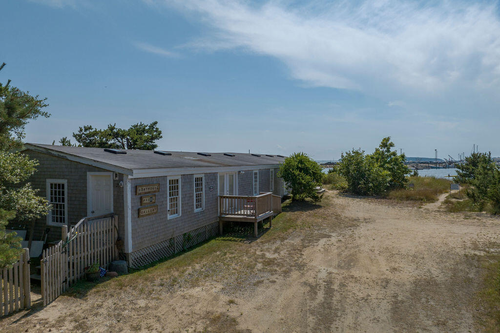 75 Richman Lane Wellfleet, MA 02667 - Photo 64 of 72 a view of a house with a yard and potted plants