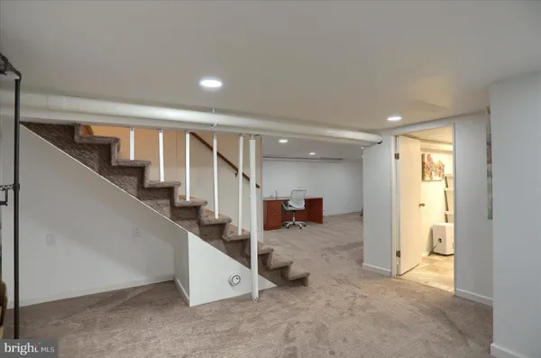 a view of a hallway with staircase