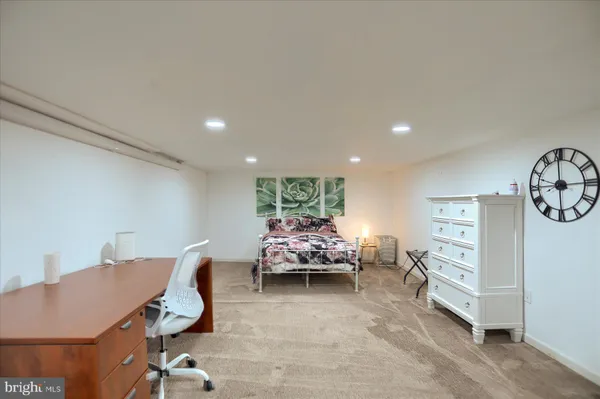 a living room with furniture and a chair