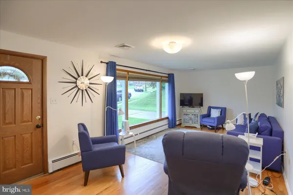 a living room with furniture and a large window