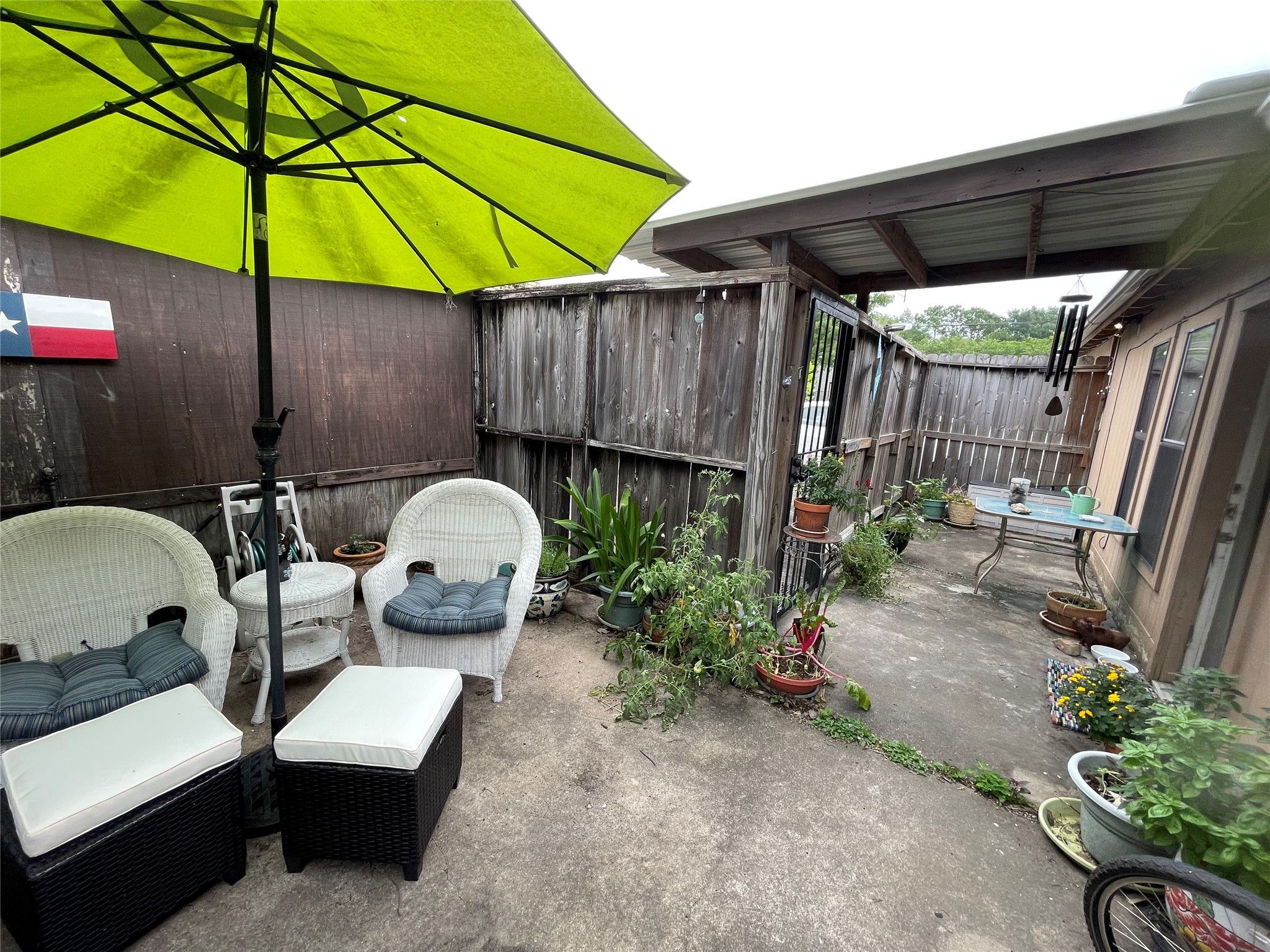 1805 Sul Ross Street Houston, TX 77098 - Photo 20 of 21 a backyard of a house with table and chairs under an umbrella