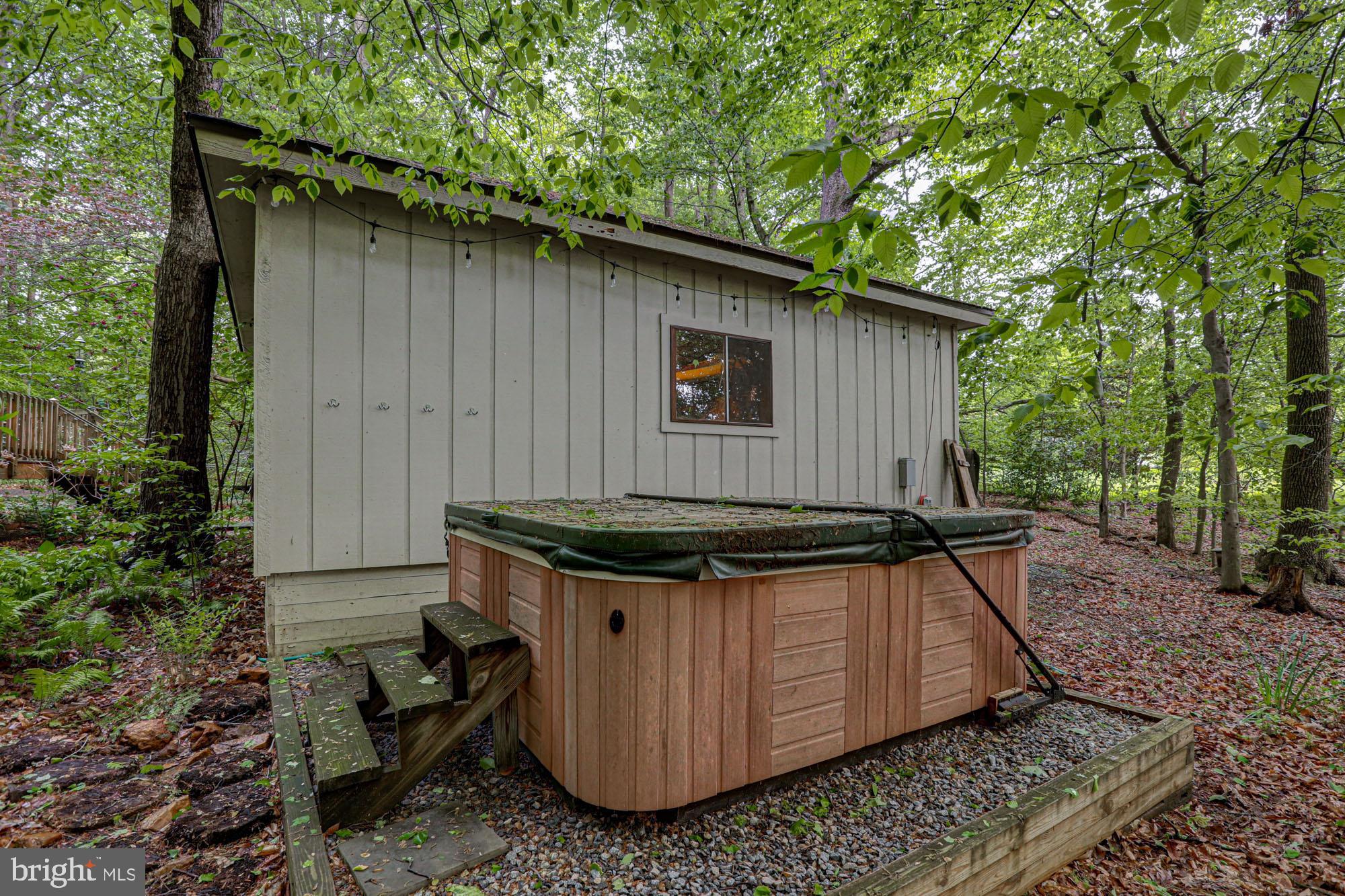 75 Good Hope Road Landenberg, PA 19350 - Photo 65 of 65 a backyard of a house with large trees and wooden fence