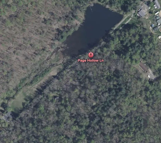 a view of a floor in a hall with white walls