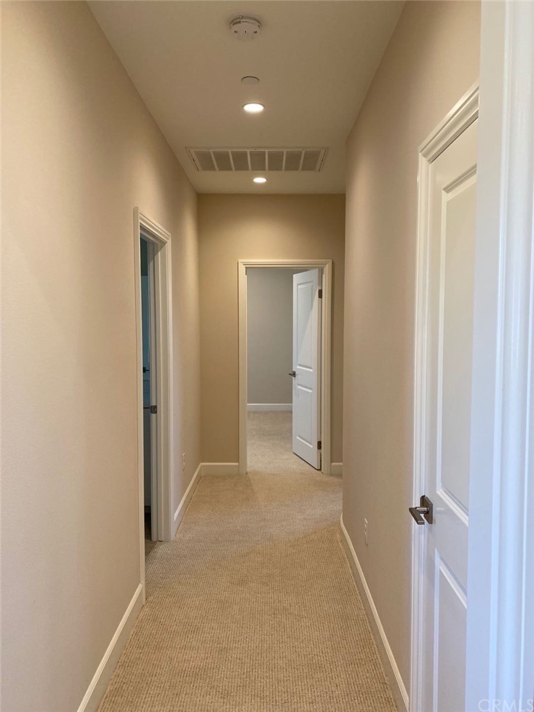 63 Singer Irvine, CA 92620 - Photo 17 of 33 a view of hallway with bathroom and a mirror
