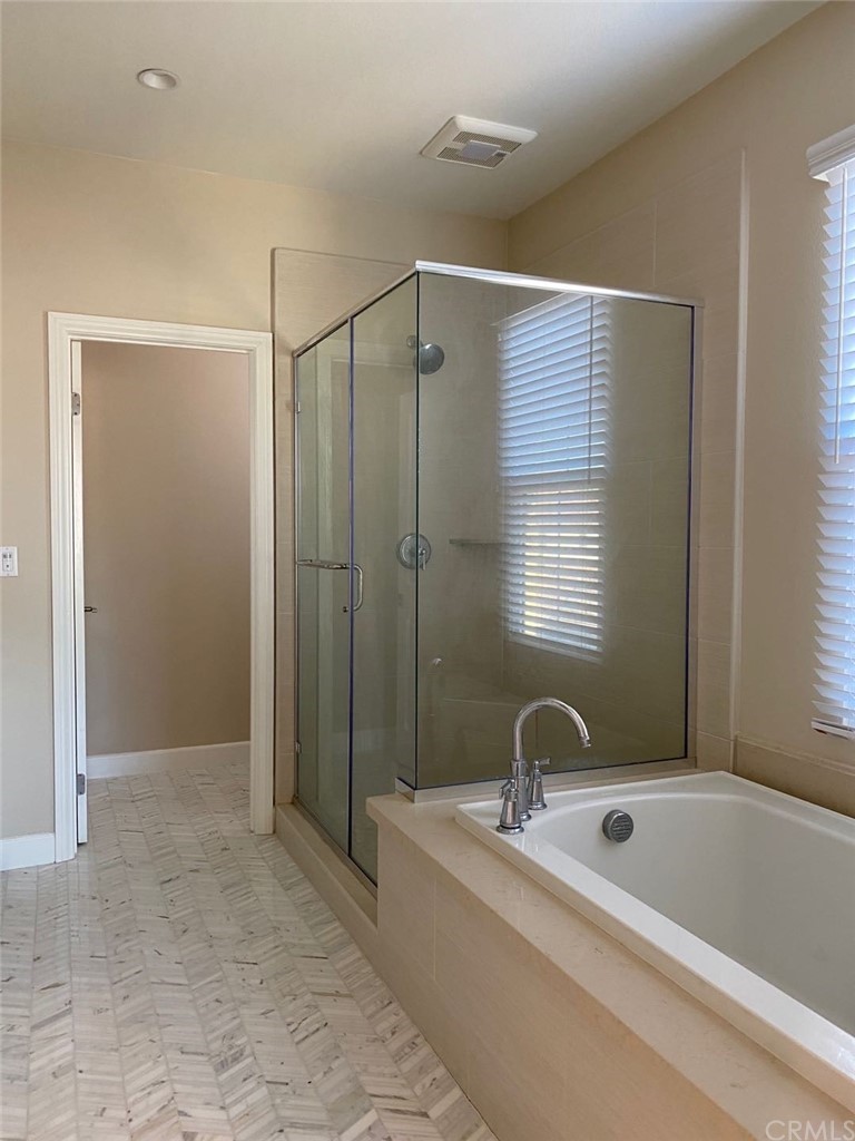 63 Singer Irvine, CA 92620 - Photo 20 of 33 a bathroom with a tub a sink and a shower