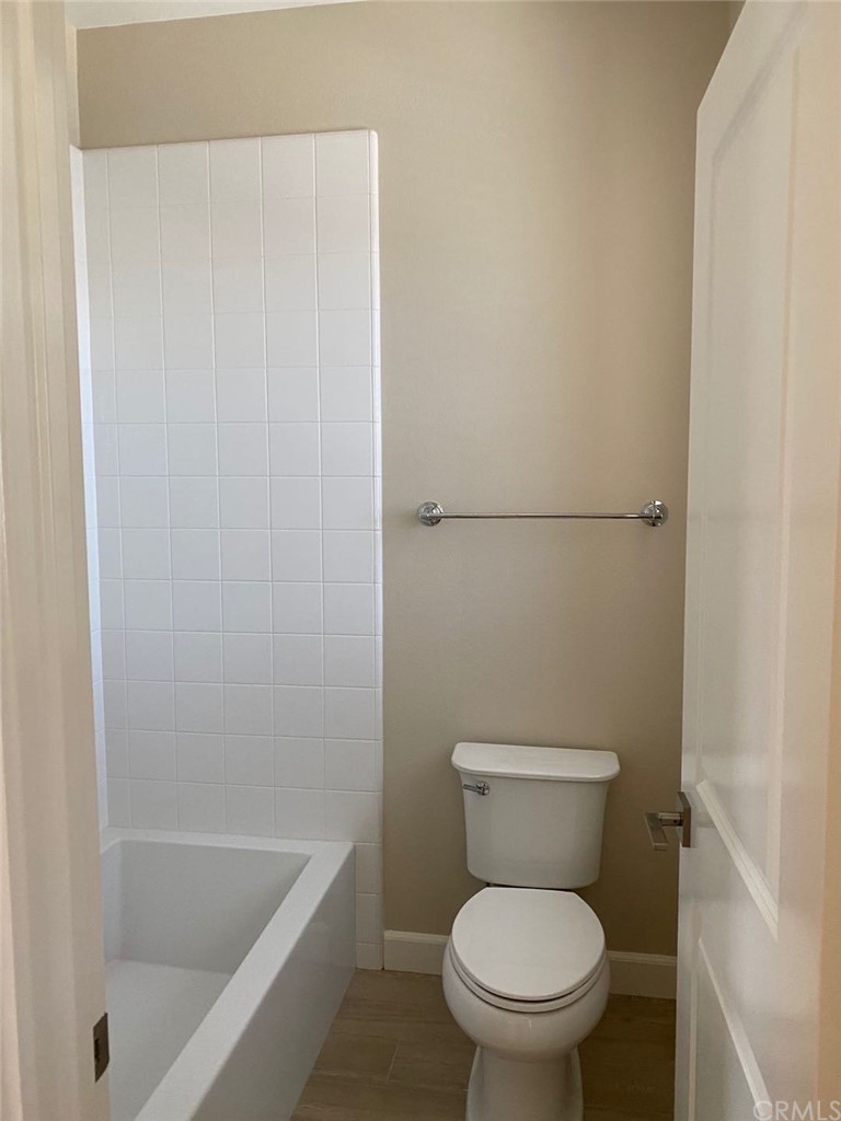 63 Singer Irvine, CA 92620 - Photo 23 of 33 a white toilet sitting next to a bathtub