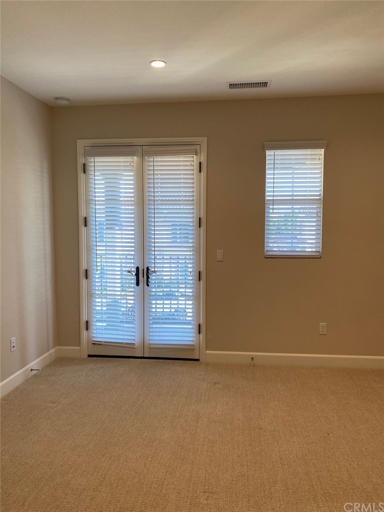 63 Singer Irvine, CA 92620 - Photo 27 of 33 an empty room with wooden floor and windows
